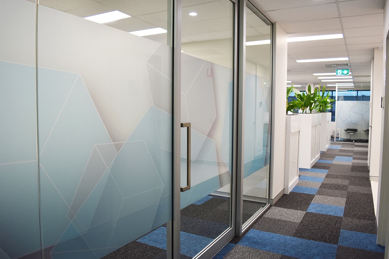 photo of office hallway with large glass doors