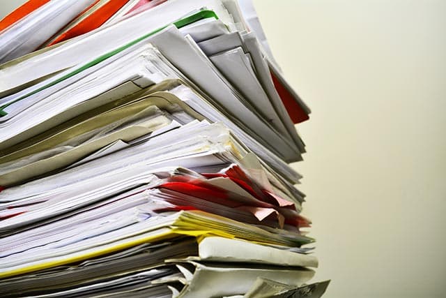 Image featuring a pile of documents.