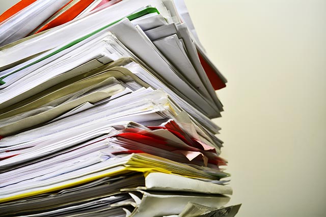 Image featuring a pile of documents.